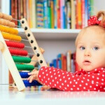 little girl playing with abacus, early learning